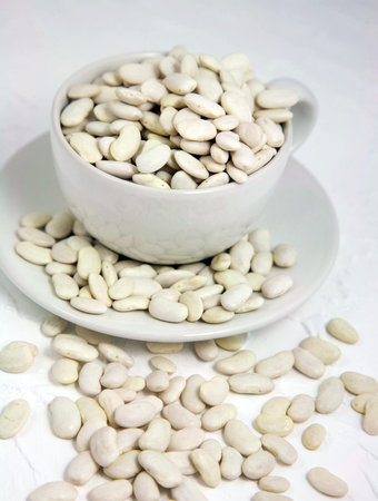 Dry white beans in a cup
