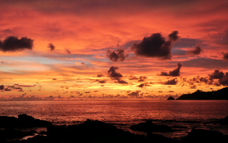 Colorful sunset at Kalim beach in Phuket island in Thailandの写真素材