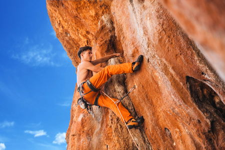 Rebellious rock climber on the wall - bold choice of real men. Turkey, Geyikbayiri - Stock Imageの写真素材