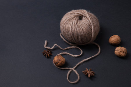 Closeup of yarn clew and walnuts.