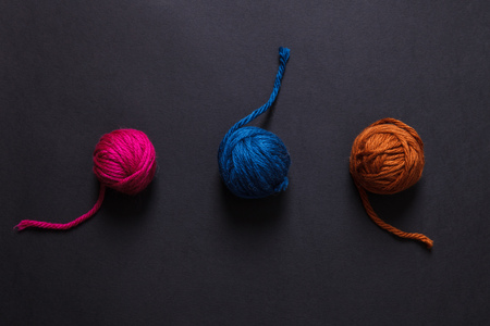 Close up of olorful yarn clews on black background. Concept of freelance creative working and happy livingの写真素材