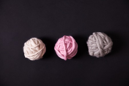 Close up of olorful yarn clews on black background. Concept of freelance creative working and happy livingの写真素材