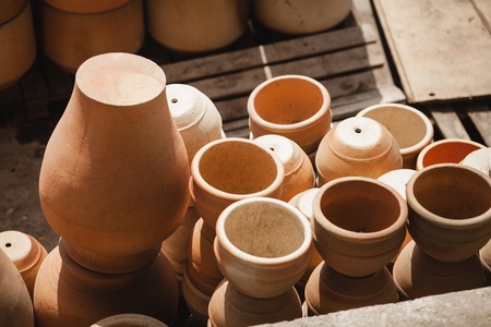 Huge roasted ceramimc pots without glaze storage. Top view. Art and business, hobby and freelance working concept.の写真素材
