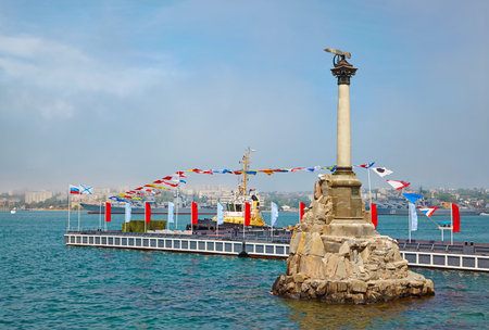 The Sunken Ships Monument, symbol of Sevastopol decorated with flags for the holiday 220 years of the Black Sea Fleetのeditorial素材