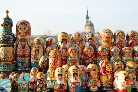 KHARKOV, UKRAINE - CIRCA SEPTEMBER 2012: Matryoshka doll on the counter of the art market. Ukrainian folk art. Annunciation Cathedral on background.のeditorial素材