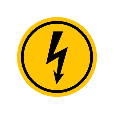 High voltage sign. Black danger icon on yellow round symbol. Vector illustration of electricity voltage. Hazard symbol. Danger pictogram, circle warning sign icon. Informing about risk and caution.のイラスト素材