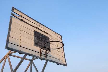 old basketball backboard, basketball hoops with blue sky backgroundの写真素材