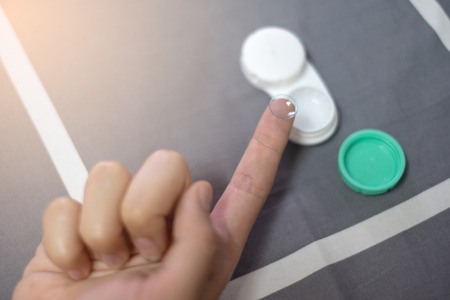 Contact eye lens or Soft eye lens on the fingerの写真素材