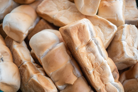 long loaf of moldy breadの写真素材