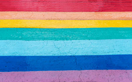 Rainbow background painted on asphalt path, copy space, colorful backdrop, freedom and friendship, abstract selective focus, peaceの写真素材