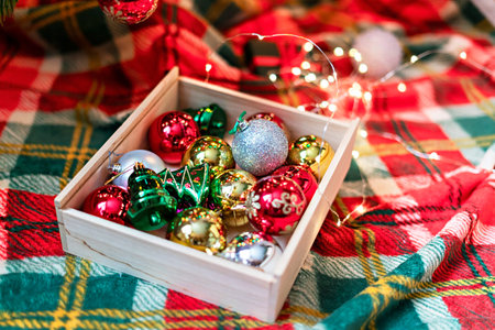 Decorations for Christmas Tree , silver and red Balls Garlands Lights on red green Background...