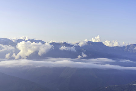 beautiful view of the mountains of the Caucasus range in pink clouds at sunset, natural background...