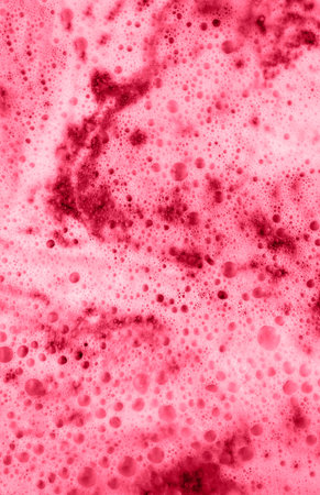 Viva Magenta color of the year 2023 Vertical background of cappuccino foam close-up Abstract, foamy...