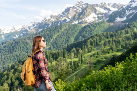 woman hiker with yellow backpack walking in mountains copy space Hiking and active lifestyleの写真素材