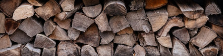 Close-up view of stacked firewood, showcasing natural wood textures and organic patterns,...
