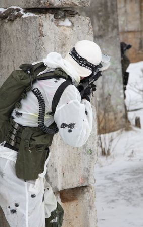 armed men in a camouflage play a paintballの写真素材