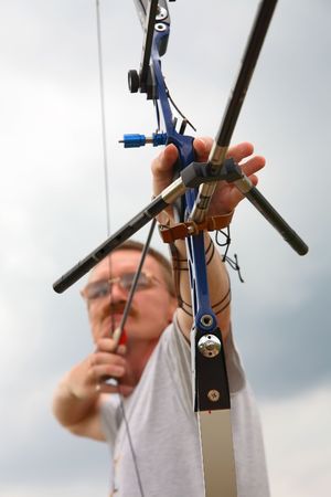 man  shooting to archery target.の写真素材
