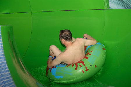 Driving from waterslides in an aquapark. Entertainment for children and adults.