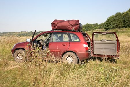 big red car for trips on the natureの写真素材