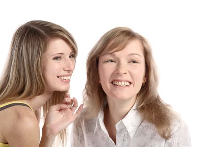 Two girlfriends talk. Close up. White background. It is isolated.の写真素材