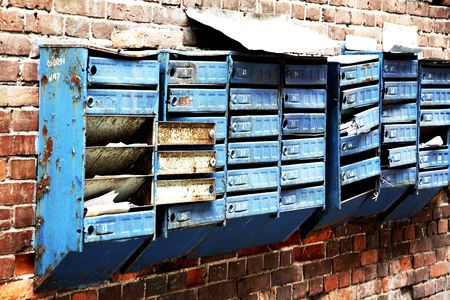 Old mail boxes on brick wallの写真素材
