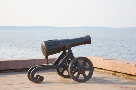 Ancient gun on quayの写真素材