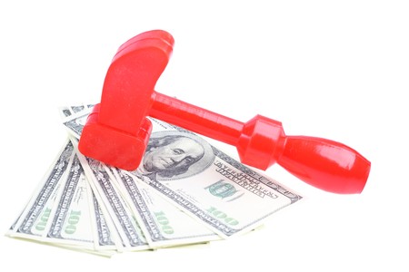 Toy hammer on money. Earning money.の写真素材