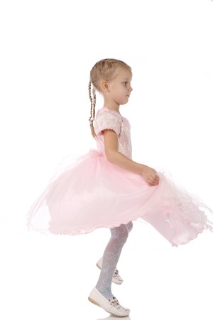 little girl in a pink elegant dress.White backgroundの写真素材