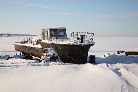 old rusty ship in snow. The Solovki, Russiaの写真素材