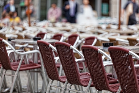 Brown wicker chairs in street cafeの写真素材