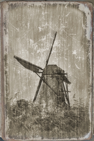 Windmill in Kinderdijk, Holland  processing under an ancient card の写真素材