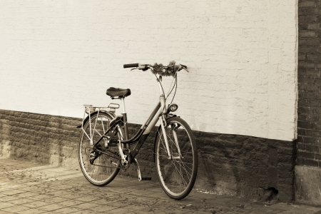 European city landscape, bicycle to stand near a wallの写真素材