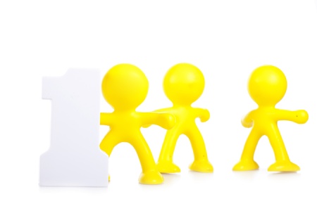 Three little men and figure 1, as leadership and victory symbolの写真素材