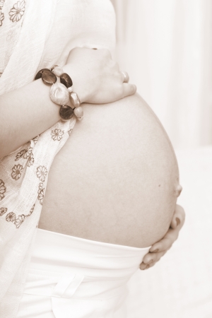 Pot-belly of the pregnant woman close upの写真素材