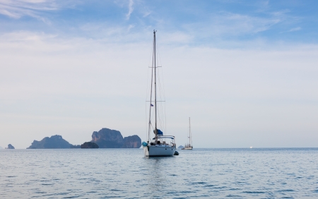 white beautiful yacht against rocks. Thailandの写真素材