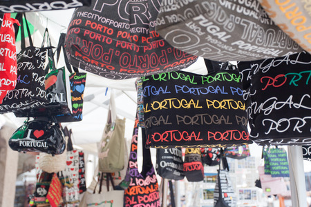 PORTUGAL, PORTO - SEPTEMBER 21, 2013: Souvenir bags in the market. To the port (port. Porto)  the city in the northwest of Portugal, the center of the district of the same name.のeditorial素材
