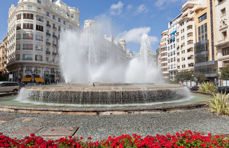 VALENCIA, SPAIN-SEPTEMBER 13, 2013: The fountain on one of the central streets of Valencia. Valencia - the third by number of inhabitants the city of Spain after Madrid and Barcelona.のeditorial素材