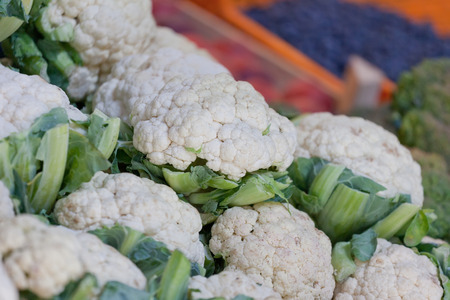 Cauliflower and other vegetables on a show-window of the vegetable marketの写真素材