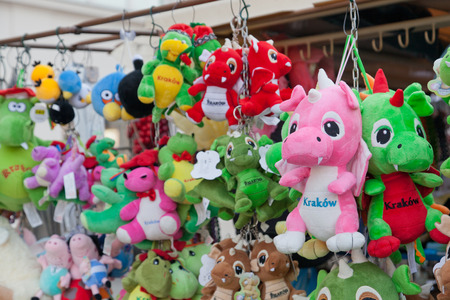 KRAKOW, POLAND - JANUARY 3, 2015: Souvenir toy dragons. Wawelsky dragon is a symbol of Krakowのeditorial素材