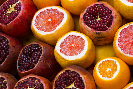 Ripe oranges and grenades for receiving freshly squeezed juiceの写真素材