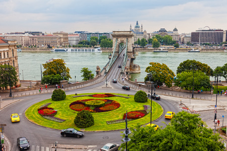 HUNGARY, BUDAPEST - JUNE 24, 2014: Traffic on Szechenyi Chain Bridge. The bridge is open in 1849, having become the first constant bridge through Danube.のeditorial素材