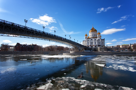 Moscow, Christ the Savior Cathedral and Patriarchal Bridge on a sunny spring day during an ice drift on the Moscow Riverのeditorial素材