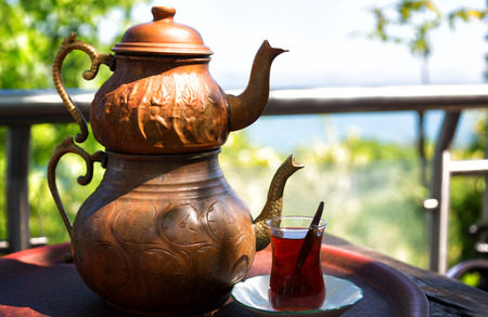 Traditional Turkish Tea with Turkish tea cup and copper tea potの写真素材