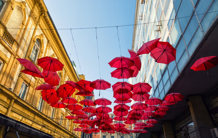 Street decorated with red umbrellas