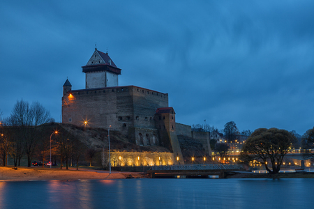 View of Narva Castle with tall Herman's tower in night. Estoniaのeditorial素材
