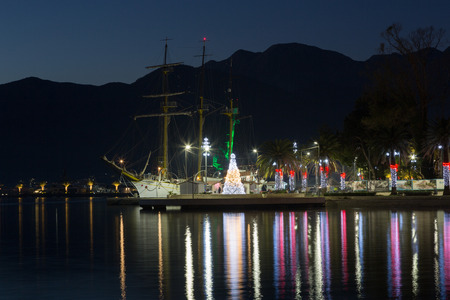 Night Embankment in Tivat, view of an old sailing ship. Montenegroのeditorial素材