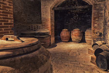 Old barrels of wine in the ancient cellar, Italyの写真素材