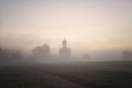 Church of Intercession upon Nerl River. (Bogolubovo, Vladimir region, Golden Ring of Russia) in autumn fog morningの写真素材