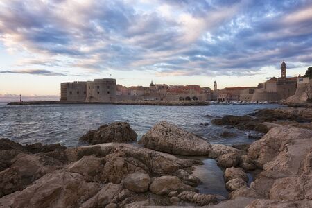 Dubrovnik, a landscape overlooking the old town and large stones in the foreground, Croatiaの写真素材