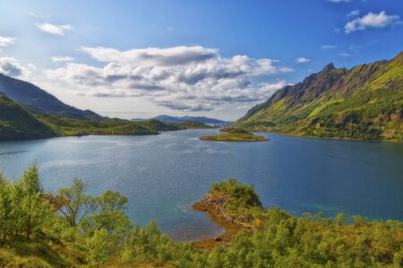 Beautiful summer Norwegian landscape with a lake and mountainsの写真素材